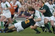 13 November 2004; Brian O'Driscoll, Ireland, is tackled by De Wet Barry, 12, and Schalk Burger, South Africa. Rugby International, Ireland v South Africa, Lansdowne Road, Dublin. Picture credit; Matt Browne / SPORTSFILE