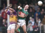 21 November 2004; Ronan McGarrity, right, Ballina Stephenites, in action against Fergal O'Donnell, Roscommon Gaels. AIB Connacht Club Senior Football Championship Semi-Final, Ballina Stephenites v Roscommon Gaels, James Stephen's Park, Ballina, Co. Mayo. Picture credit; David Maher / SPORTSFILE