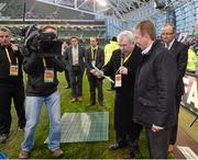 3 November 2013; John Toal , in the company of MC Aidan Cooney and Eddie Murphy, right, Managing Director, Ford Ireland, prepare to make the draw the winning ticket for the Regional Car draw for Leinster during the FAI National Draw at half-time. Aviva Stadium, Lansdowne Road, Dublin. Picture credit: Brendan Moran / SPORTSFILE