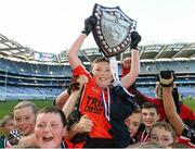 4 November 2013; Holy Trinity N.S, Donaghmede, Co. Dublin, captain Paddy Bridgeman lifts the cup alongside his team-mates. Allianz Cumann na mBunscol Football Finals, Croke Park, Dublin. Picture credit: David Maher / SPORTSFILE