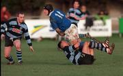 13 February 1999; John McWeeney of St Mary's College is tackled by Andrew Thompson of Shannon as team-mate Jim Galvin, left, looks on during the AIB All-Ireland League Division 1 match between St Mary's College and Shannon RFC at Templeville Road in Dublin. Photo by Brendan Moran/Sportsfile