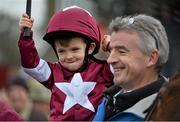 10 November 2013; Owner Michael O'Leary, CEO of Ryanair, with Alan Jordan aged 4, from Navan, Co. Meath, in the winners enclosure after winning the Boylesports.com Download Our App Lismullen Hurdle with Dedigout. Navan Racecourse, Navan, Co. Meath. Picture credit: Barry Cregg / SPORTSFILE