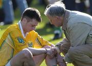 17 March 2004; Michael McClements, Dunloy, is comforted by Chris Morrisey, a lifelong member of the Newtownshandrum club. AIB All-Ireland Club Hurling Final, Newtownshandrum v Dunloy, Croke Park, Dublin, Picture credit; Ray McManus / SPORTSFILE *EDI*