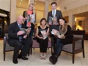 12 November 2013; Author Donal Keenan, left, with members of Páidí Ó Sé's family, from left to right, daughter Siún, wife Máire, son Pádraig Og and daughter Neasa, in attendance at the launch of his book &quot;Páidí - A big life&quot;. Launch of Páidí Ó Sé Book, D4 Ballsbridge Hotel, Ballsbridge Dublin. Picture credit: Barry Cregg / SPORTSFILE