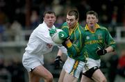 9 January 2005; Stephen Mac Gabhann, Meath, holds possession under pressure from Kildare's Ross Galvin. O'Byrne Cup, Quarter-Final, Kildare v Meath, St. Conleth's Park, Newbridge, Co. Kildare. Picture credit; Ray McManus / SPORTSFILE