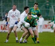 9 January 2005; Coihin King, Meath, under pressure from Kildare's David Lyons. O'Byrne Cup, Quarter-Final, Kildare v Meath, St. Conleth's Park, Newbridge, Co. Kildare. Picture credit; Ray McManus / SPORTSFILE