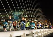 13 November 2013; A general view of competitors as they make their way along the Samuel Beckett Bridge during the Lifestyle Sports Run in the Dark 2013. Samuel Beckett Bridge, Dublin. Picture credit: Ramsey Cardy / SPORTSFILE