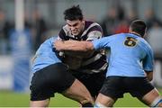 15 November 2013; Kevin O'Dwyer, Terenure, is tackled by Risteard Byrne, left, and Eoin Joyce, UCD. Leinster Senior League Cup Final, Terenure v UCD, Donnybrook Stadium, Donnybrook, Dublin. Picture credit: Ramsey Cardy / SPORTSFILE