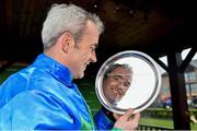 17 November 2013; Jockey Ruby Walsh holds the winners plate after he rode Hurricane Fly to win the StanJames.com Morgiana Hurdle. Hurricane Fly became the first horse ever to win 17 Grade 1 races. Punchestown Racecourse, Punchestown, Co. Kildare. Picture credit: Barry Cregg / SPORTSFILE