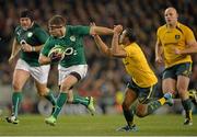 16 November 2013; Fergus McFadden, Ireland, holds off the tackle of Will Genia, Australia. Guinness Series International, Ireland v Australia, Aviva Stadium, Lansdowne Road, Dublin. Picture credit: Brendan Moran / SPORTSFILE