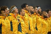16 November 2013; The Australian team, including Nick Cummins and Quade Cooper, 3rd and 4th from left respectively, stand for the National Anthems before the game. Guinness Series International, Ireland v Australia, Aviva Stadium, Lansdowne Road, Dublin. Picture credit: Brendan Moran / SPORTSFILE