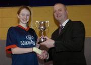 1 February 2005; Suil Collins, St. Paul's Oughterard, Galway, is presented with the cup by Martin Hehir, Schools Development Officer, Basketball Ireland. All-Ireland Schools Cup, Cadette B Final, Colaiste Choilm Ballincollig, Cork, v St. Paul's Oughterard, Galway, National Basketball Arena, Tallaght, Dublin. Picture credit; Brian Lawless / SPORTSFILE