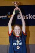 1 February 2005; Suil Collins, St. Paul's Oughterard, Galway, lifts the cup after victory in the final. All-Ireland Schools Cup, Cadette B Final, Colaiste Choilm Ballincollig, Cork, v St. Paul's Oughterard, Galway, National Basketball  Arena, Tallaght, Dublin. Picture credit; Brian Lawless / SPORTSFILE
