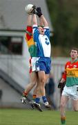 6 February 2005; Dermot McArdle, Monaghan, in action against David Nolan, Carlow. Allianz National Football League, Division 2A, Monaghan v Carlow, O'Neill Park, Clontibrit, Co. Monaghan. Picture credit; Pat Murphy / SPORTSFILE