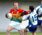 6 February 2005; David Nolan, Carlow, in action against Stephen Gollogly, Monaghan. Allianz National Football League, Division 2A, Monaghan v Carlow, O'Neill Park, Clontibrit, Co. Monaghan. Picture credit; Pat Murphy / SPORTSFILE