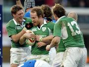 6 February 2005; Ireland's Denis Hickie is congratulated by team-mates Ronan O'Gara, left, and Brian O'Driscoll (13), after scoring his sides third try against Italy. RBS Six Nations Championship 2005, Italy v Ireland, Stadio Flamino, Rome, Italy. Picture credit; Brendan Moran / SPORTSFILE