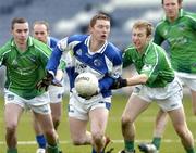 6 February 2005; Tom McDonald, Laois, in action against Michael Reidy, left, and Ger Ahern, Limerick. Allianz National Football League, Division 1B, Laois v Limerick, O'Moore Park, Portlaoise, Co. Laois. Picture credit; Matt Browne / SPORTSFILE