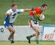 6 February 2005; Thomas Walsh, Carlow, in action against James Ward, Monaghan. Allianz National Football League, Division 2A, Monaghan v Carlow, O'Neill Park, Clontibrit, Co. Monaghan. Picture credit; Pat Murphy / SPORTSFILE