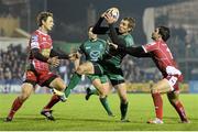 23 November 2013; Gavin Duffy, Connacht, is tackled by Nick Reynolds, left, and Gareth Owen, Scarlets. Celtic League 2013/14, Round 8, Connacht v Scarlets, The Sportsground, Galway. Picture credit: Diarmuid Greene / SPORTSFILE