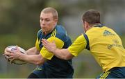 27 November 2013; Munster's Keith Earls is tackled by JJ Hanrahan during squad training ahead of their Celtic League 2013/14, Round 9, game against Newport Gwent Dragons on Friday. Munster Rugby Squad Training, Cork Institute of Technology, Bishopstown, Cork. Picture credit: Matt Browne / SPORTSFILE