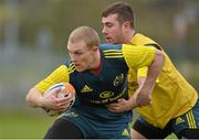 27 November 2013; Munster's Keith Earls is tackled by JJ Hanrahan during squad training ahead of their Celtic League 2013/14, Round 9, game against Newport Gwent Dragons on Friday. Munster Rugby Squad Training, Cork Institute of Technology, Bishopstown, Cork. Picture credit: Matt Browne / SPORTSFILE