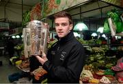 28 November 2013; Clare's Tony Kelly, with the Liam MacCarthy cup, at a local market area near the team hotel on Minsheng Road, Shanghai, in advance of the GAA GPA All Star Tour 2013, sponsored by Opel, game on Saturday. Picture credit: Ray McManus / SPORTSFILE