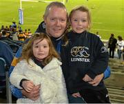 30 November 2013; Leinster supporters Juliette, left, and Grace with their father Stan O'Neill at the game. Celtic League 2013/14 Round 9, Leinster v Scarlets, RDS, Ballsbridge, Dublin. Picture credit: Ramsey Cardy / SPORTSFILE