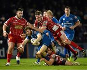 30 November 2013; Gordon D'Arcy, Leinster, is tackled by Adam Warren, above, and Johan Snyman, Scarlets. Celtic League 2013/14, Round 9, Leinster v Scarlets, RDS, Ballsbridge, Dublin. Picture credit: Stephen McCarthy / SPORTSFILE