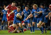 30 November 2013; Gordon D'Arcy, Leinster, is tackled by Gareth Davies, Scarlets. Celtic League 2013/14, Round 9, Leinster v Scarlets, RDS, Ballsbridge, Dublin. Picture credit: Stephen McCarthy / SPORTSFILE