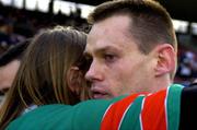 20 February 2005; Kilmurray-Ibrickane captain Odhran O'Dwyer is consoled by a fan after the game. AIB All-Ireland Club Senior Football Championship Semi-Final, Ballina Stephenites v Kilmurray-Ibrickane, Pearse Stadium, Galway. Due to a colour clash both teams wear their provincial colours. Picture credit; Pat Murphy / SPORTSFILE