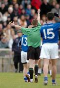 20 February 2005; Michael Hogan, 13, Kilmurray-Ibrickane, is shown the red card by referee Joe McQuillan. AIB All-Ireland Club Senior Football Championship Semi-Final, Ballina Stephenites v Kilmurray-Ibrickane, Pearse Stadium, Galway. Due to a colour clash both teams wear their provincial colours. Picture credit; Pat Murphy / SPORTSFILE