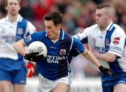 20 February 2005; Michael O'Dwyer, Kilmurray-Ibrickane, in action against Enda Devenney, Ballina Stephenites. AIB All-Ireland Club Senior Football Championship Semi-Final, Ballina Stephenites v Kilmurray-Ibrickane, Pearse Stadium, Galway. Due to a colour clash both teams wear their provincial colours. Picture credit; Pat Murphy / SPORTSFILE