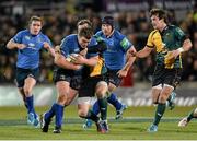 7 December 2013; Jack McGrath, Leinster, is tackled by Stephen Myler, Northampton Saints. Heineken Cup 2013/14, Pool 1, Round 3, Northampton Saints v Leinster. Franklins Gardens, Northampton, England. Picture credit: Stephen McCarthy / SPORTSFILE