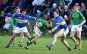 6 March 2005; Caoimhin King, Meath, in action against Glen Burke and Eamon Hanrahan, Tipperary. Allianz National Football League, Division 2B, Tipperary v Meath, Clonmel Sports Field, Clonmel, Co. Tipperary. Picture credit; Kieran Clancy / SPORTSFILE