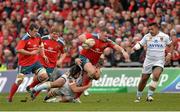 8 December 2013; Dave Kilcoyne, Munster, is tackled by Jean-Pierre Perez, left, and Paulica Ion, Perpignan. Heineken Cup 2013/14, Pool 6, Round 3, Munster v Perpignan, Thomond Park, Limerick. Picture credit: Diarmuid Greene / SPORTSFILE