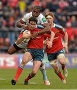 8 December 2013; Felix Jones, Munster, is tackled by Watisoni Votu, Perpignan. Heineken Cup 2013/14, Pool 6, Round 3, Munster v Perpignan, Thomond Park, Limerick. Picture credit: Diarmuid Greene / SPORTSFILE