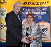 10 December 2013; Ann Marie Fitzgerald receives the Ivan Webb trophy for Most Outstanding Contribution to Irish Motorsport award from Michael Fitzsimmons, Chairman of the Selection Panel, at the Dunlop Motorsport Ireland Awards 2013. The Marker Hotel, Grand Canal Dock, Dublin. Picture credit: Barry Cregg / SPORTSFILE
