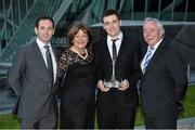 10 December 2013; Niall Murray holds the Dunlop Sexton trophy for Young Racing Driver of the Year with his Parents Joe and Ann and brother Eoin, who previously won the award, at the Dunlop Motorsport Ireland Awards 2013. The Marker Hotel, Grand Canal Dock, Dublin. Picture credit: Barry Cregg / SPORTSFILE