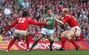 19 March 2005; Geordan Murphy, Ireland, is tackled by Gavin Henson, 12, and Tom Shanklin, Wales. RBS Six Nations Championship 2005, Wales v Ireland, Millennium Stadium, Cardiff, Wales. Picture credit; Pat Murphy / SPORTSFILE