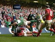 19 March 2005; Anthony Foley, Ireland, touches the flag before touching down for a try that was disallowed despite the tackle of Shane Williams, Wales. RBS Six Nations Championship 2005, Wales v Ireland, Millennium Stadium, Cardiff, Wales. Picture credit; Brendan Moran / SPORTSFILE