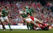 19 March 2005; Kevin Maggs, Ireland, offloads to team-mate Johnny O'Connor while being tackled by Gethin Jenkins, Wales. RBS Six Nations Championship 2005, Wales v Ireland, Millennium Stadium, Cardiff, Wales. Picture credit; Brendan Moran / SPORTSFILE