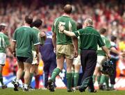 19 March 2005; Paul O'Connell, Ireland, leaves the field accompanied by Mike McGurn, left, and Willie Bennett. RBS Six Nations Championship 2005, Wales v Ireland, Millennium Stadium, Cardiff, Wales. Picture credit; Brendan Moran / SPORTSFILE