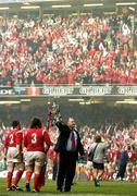19 March 2005; Wales coach Mike Ruddock celebrates with the SIx Nations trophy in fromt of a celebrating Welsh crowd. RBS Six Nations Championship 2005, Wales v Ireland, Millennium Stadium, Cardiff, Wales. Picture credit; Brendan Moran / SPORTSFILE