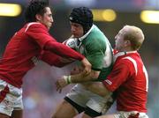 19 March 2005; David Humphreys, Ireland, is tackled by Gavin Henson, left, and Tom Shanklin, Wales. RBS Six Nations Championship 2005, Wales v Ireland, Millennium Stadium, Cardiff, Wales. Picture credit; Brendan Moran / SPORTSFILE