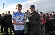 19 December 2013; Maynooth Post Primary captain Owen Byrne is presented with the cup by Chairman of Leinster GAA Colleges Damien Fee. Dublin Schools Senior “A” Football Final, St Benildus College v Maynooth Post Primary. O'Toole Park, Crumlin, Dublin. Picture credit: Barry Cregg / SPORTSFILE
