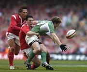 19 March 2005; Brian O'Driscoll, Ireland, loses possession while being tackled by Stephen Jones and Gavin Henson, left, Wales. RBS Six Nations Championship 2005, Wales v Ireland, Millennium Stadium, Cardiff, Wales. Picture credit; Brendan Moran / SPORTSFILE