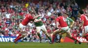 19 March 2005; Malcolm O'Kelly, Ireland, is tackled by Brent Cockbain, Wales. RBS Six Nations Championship 2005, Wales v Ireland, Millennium Stadium, Cardiff, Wales. Picture credit; Brendan Moran / SPORTSFILE