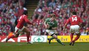 19 March 2005; Brian O'Driscoll, Ireland, in action against Gavin Henson, left, and Rhys Williams, Wales. RBS Six Nations Championship 2005, Wales v Ireland, Millennium Stadium, Cardiff, Wales. Picture credit; Brendan Moran / SPORTSFILE