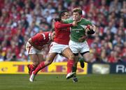 19 March 2005; Brian O'Driscoll, Ireland, is tackled by Gavin Henson, Wales. RBS Six Nations Championship 2005, Wales v Ireland, Millennium Stadium, Cardiff, Wales. Picture credit; Brendan Moran / SPORTSFILE