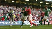 19 March 2005; Anthony Foley, Ireland, is tackled by Shane Williams, Wales. RBS Six Nations Championship 2005, Wales v Ireland, Millennium Stadium, Cardiff, Wales. Picture credit; Brendan Moran / SPORTSFILE